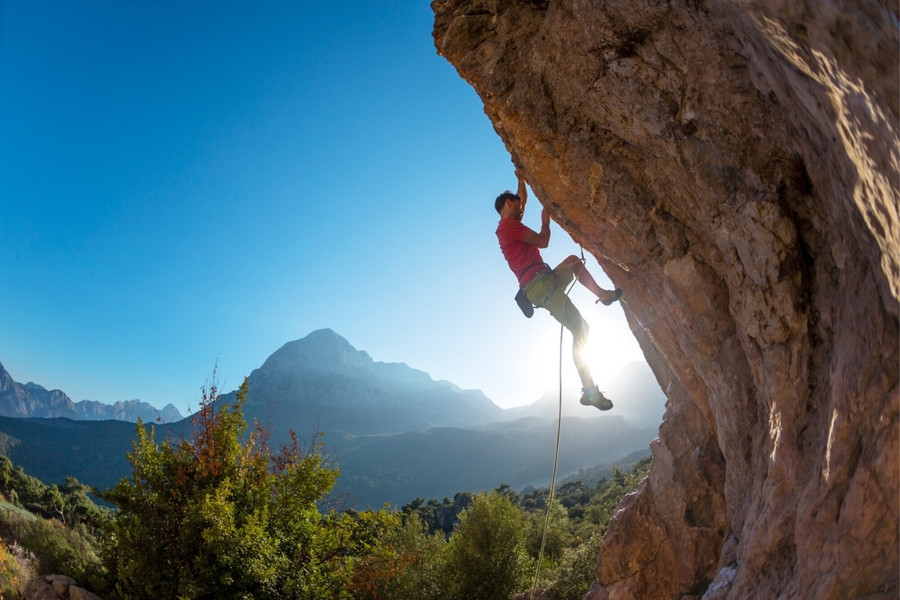 Climber on an overhanging rock